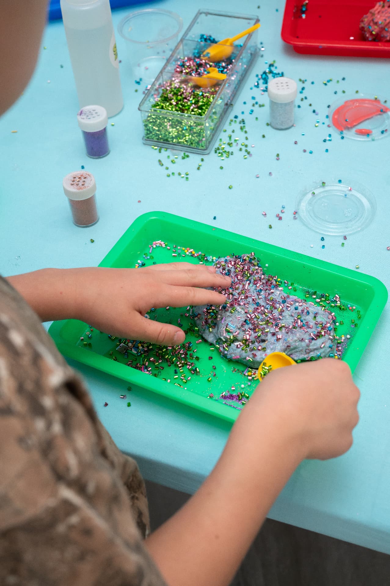 Adding sprinkles and glitter to custom slime