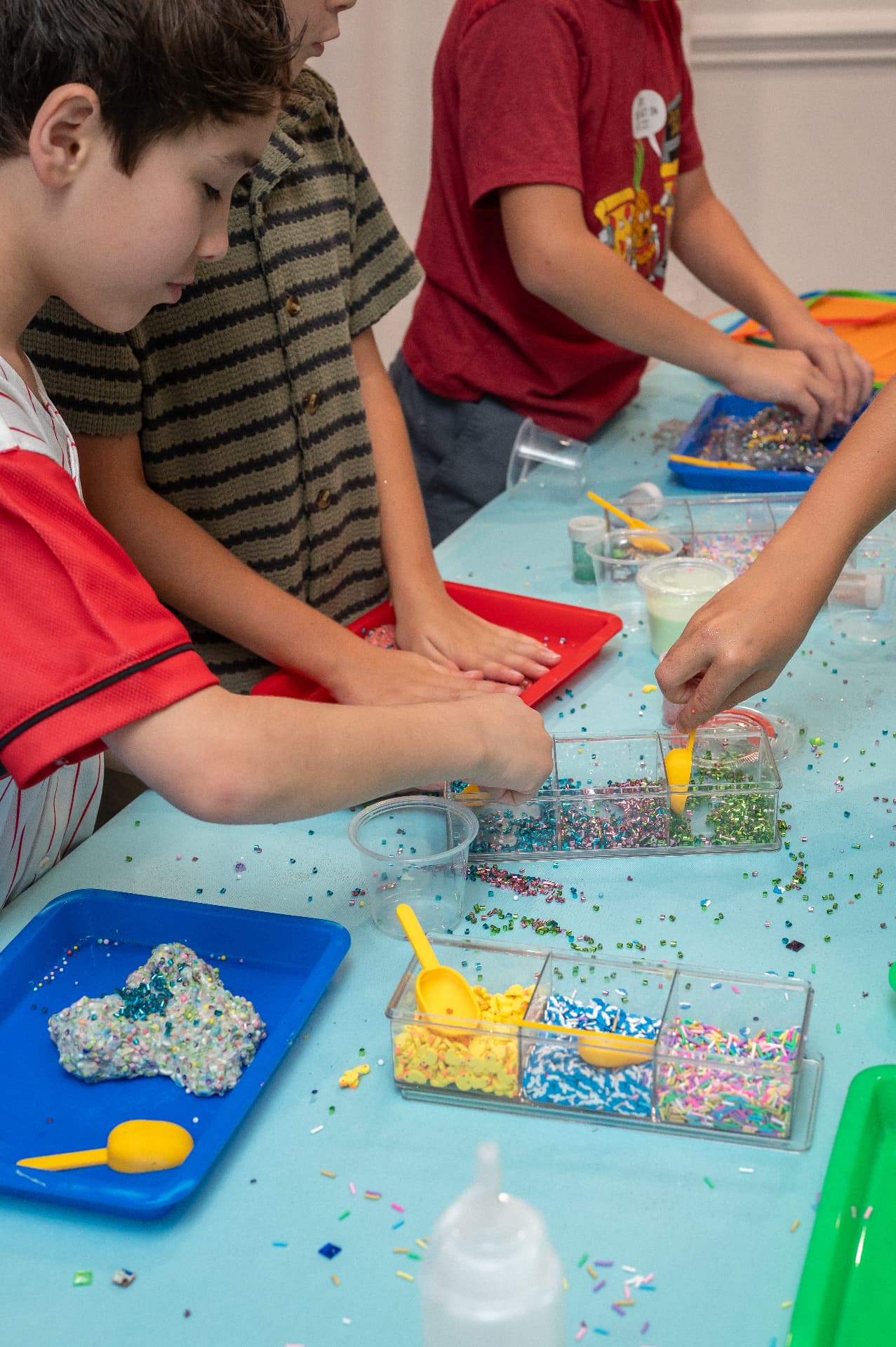 Mix-in bar with sprinkles, charms and colorful trays